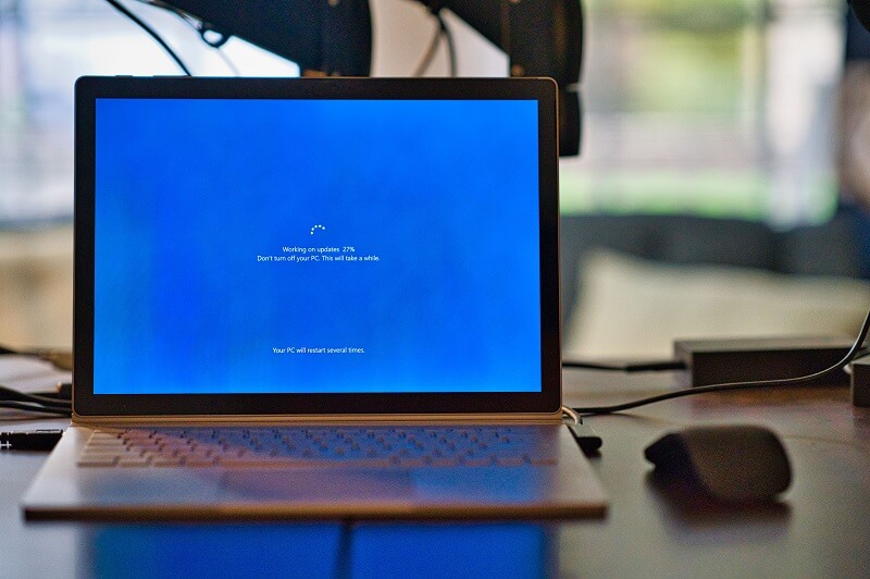 Image of laptop that is being updated demonstrating percentage complete of update